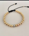 Pulsera con balines #5 tres oros.
